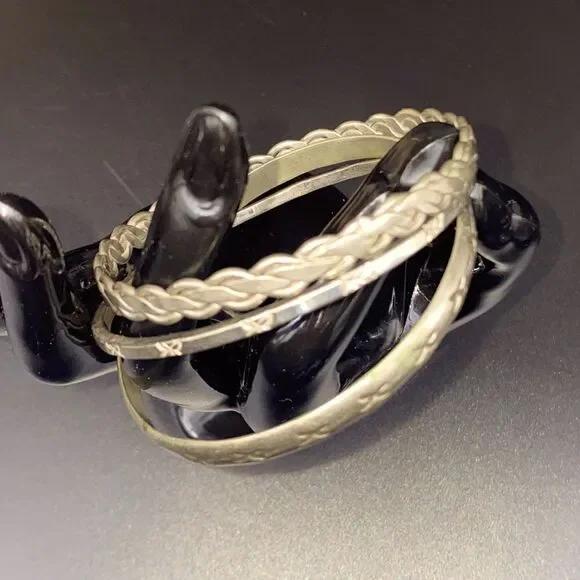 Ladies Mexican silver bangles, braided and stamped, 1/8” to 1/4” in width.
